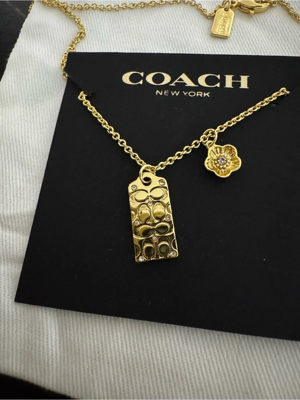 Coach Gold-Tone Logo Tag and Flower Charm Necklace